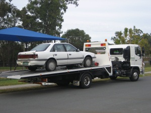 Ford Telstar Ghia on the tow truck after being written off in motorway accident