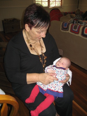 Evie being nursed by Judy Lattimore