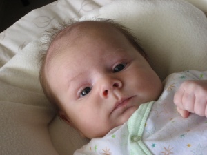 Hugo Lattimore, 2 months old enjoying sitting in a padded vibrating chair