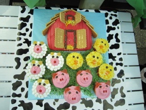 Hugo's 2nd birthday barnyard cake, complete with cupcake animals
