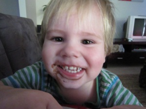 Hugo with chocolate ice cream on his face