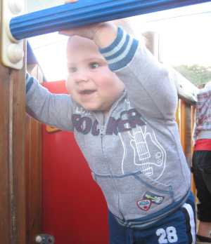 Hugo Lattimore at 10 months of age playing on fort