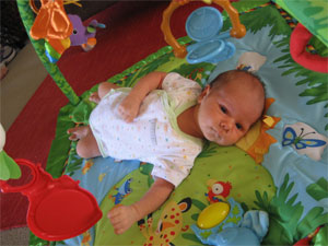 Hugo Lattimore at age 1 month enjoying time on the playmat