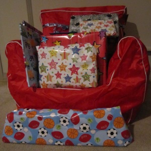 Hugo's second birthday red bean bag chair filled with presents