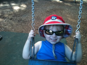 Hugo Swinging With Red Bucket Hat, Sunglasses & A Big Smile