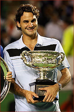 Roger Federer holding the Norman Brookes Challenge Cup after securing his third Australian Open Tennis title