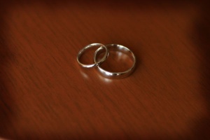 White gold wedding rings on a wood table